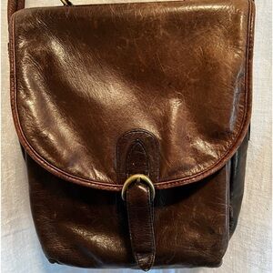 Tannery West leather bag in deep brown. Plaid inside. Shoulder and handle strap